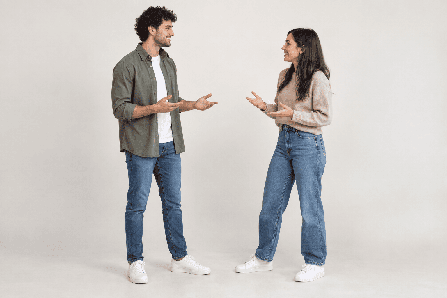 Two students facing each other in conversation.